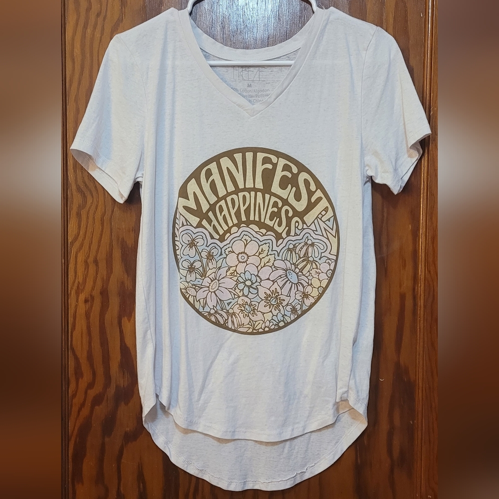 White tee with design on front.